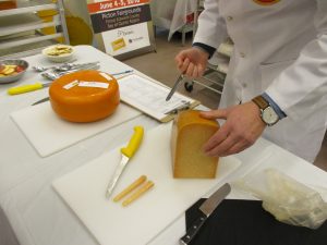 Two samples of cheese obtained from a large segment of cheese by inserting a cheese trier into the cheese block.