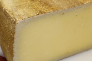 Cheese showing calcium precipitates on the edges